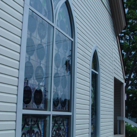 Exterior with stained glass and storm covering